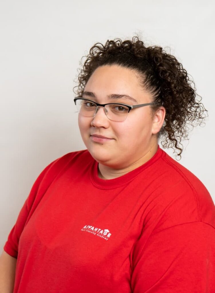 Portrait Of A Team Member In A Red Advantage Shirt