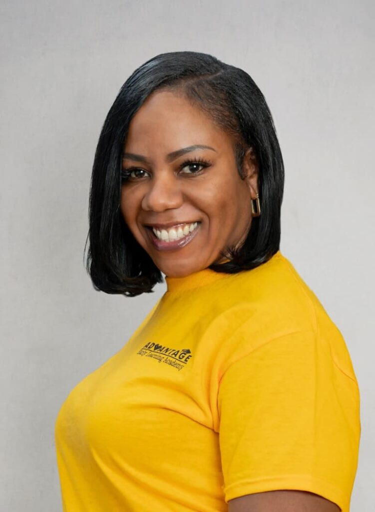 Portrait Of A Smiling Team Member In A Yellow Advantage Shirt