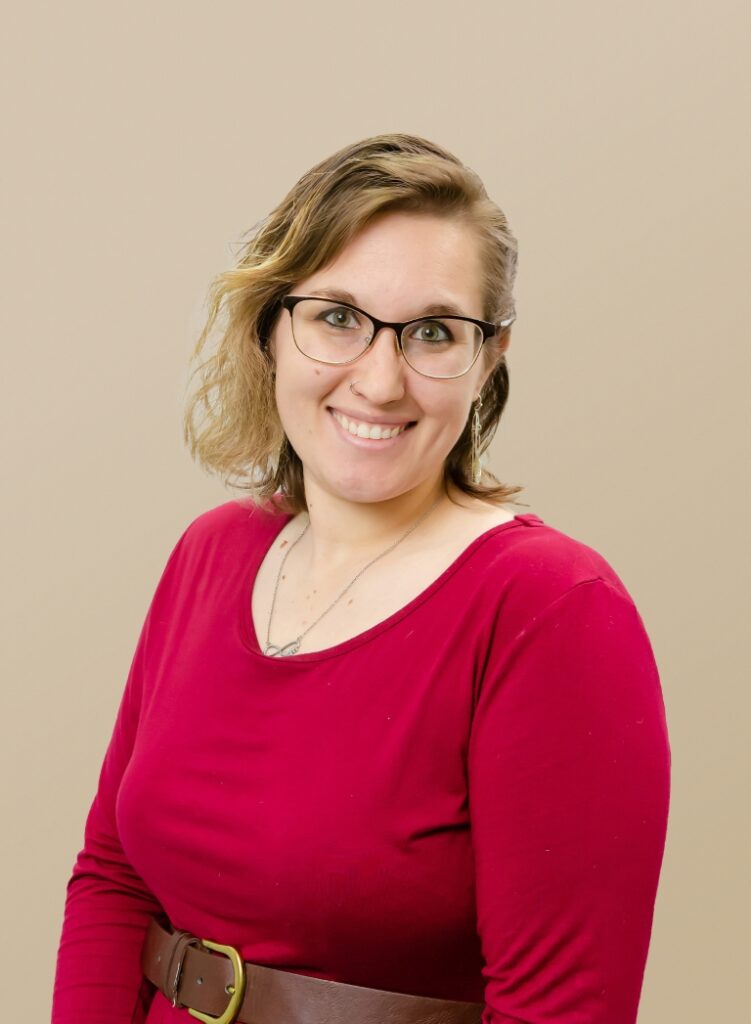Portrait Of A Team Member In A Red Dress