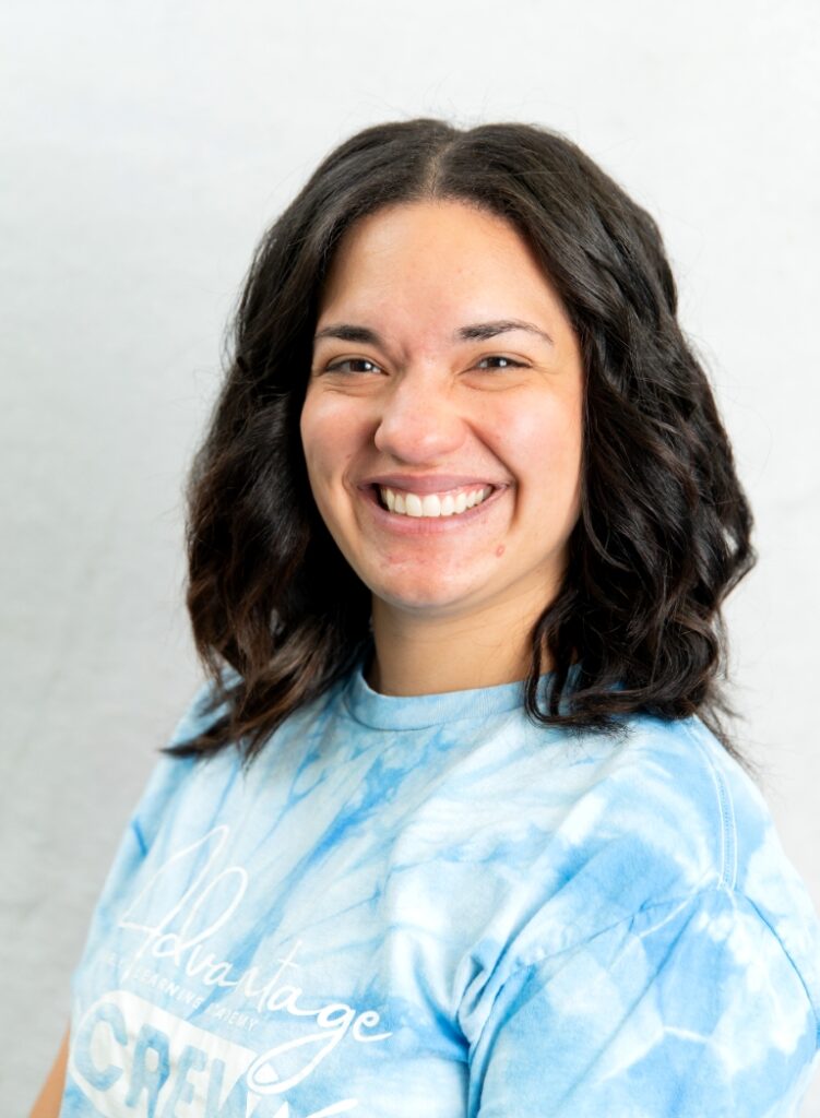 Portrait Of A Smiling Team Member In A Light Blue Shirt