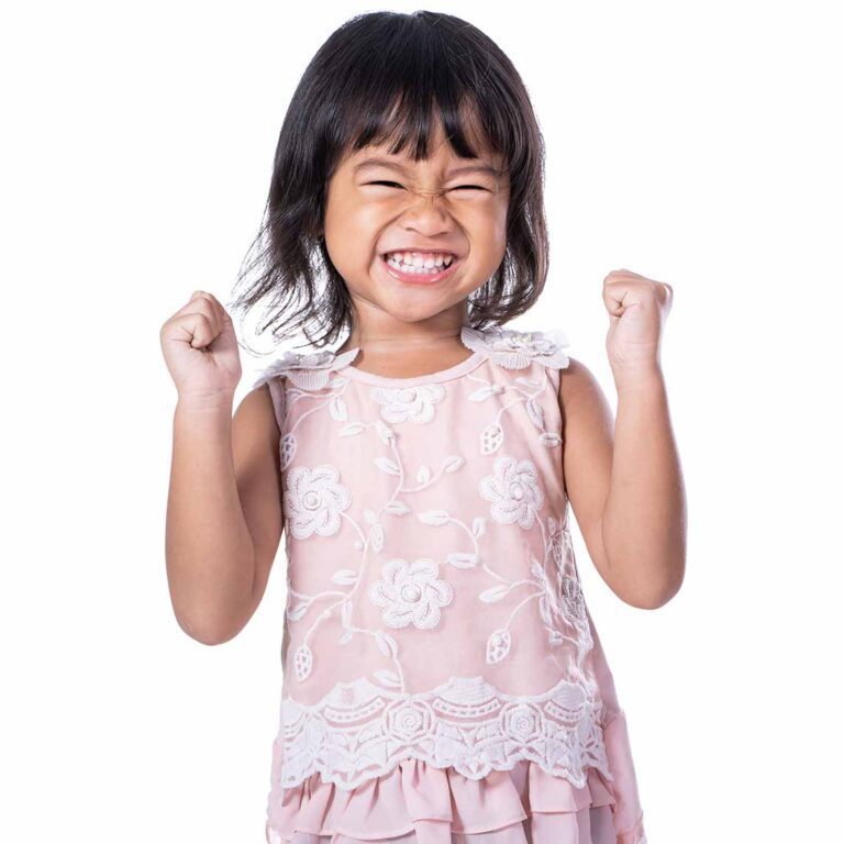 Smiling Toddler In A Pink Dress