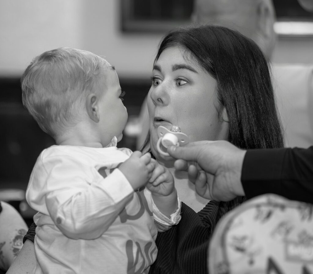 Caregiver Supporting A Baby During Infant Care In Ohio